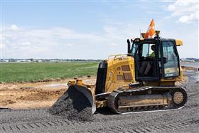 Lehigh Valley Division: A Caterpillar D5K II dozer grades stone at ABE International Airport. 