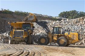 Penn/MD Quarry: A John Deere 944X loads a Komatsu HD605-8 truck with material down in the pit. 